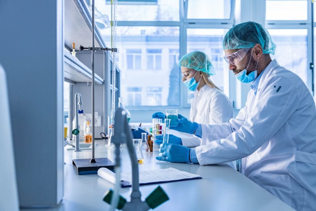 Laboratory scientists working in a regulated pharmaceutical lab in Ireland